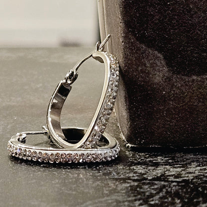 Style MELFI Silver: Abstract Heart Shaped Hoops embedded with Zirconia Gemstones