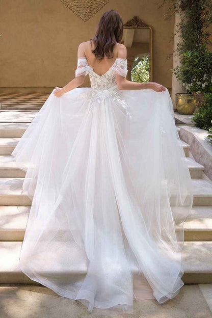 Off-the-shoulder illusion neckline with floral appliqué